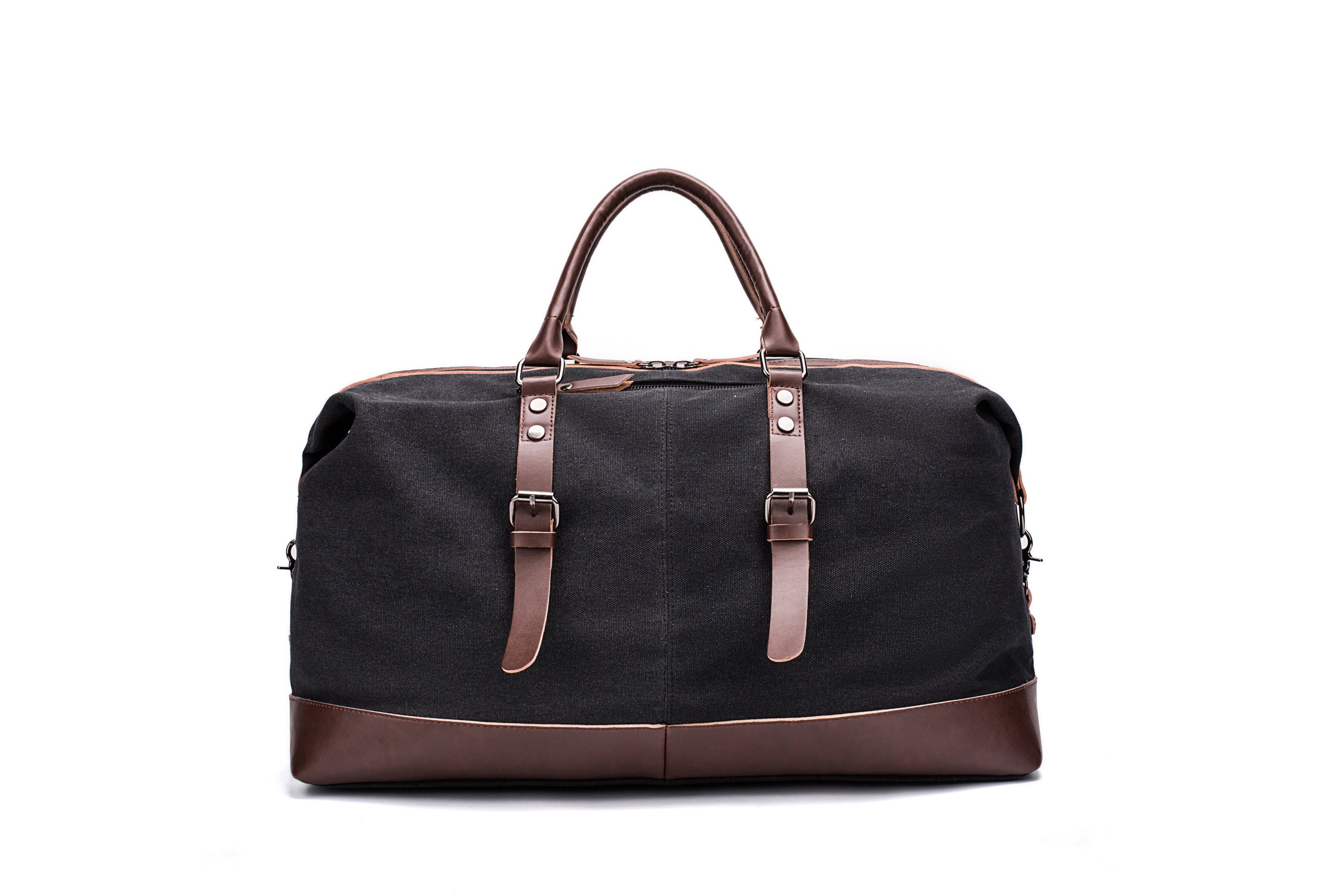 A black and brown Parvus 42L Duffel Bag, perfect as a weekend bag, travel bag, and carry-on luggage. This stylish and durable bag features seven pockets and genuine leather accents, making it ideal for short getaways, longer trips, and daily use.