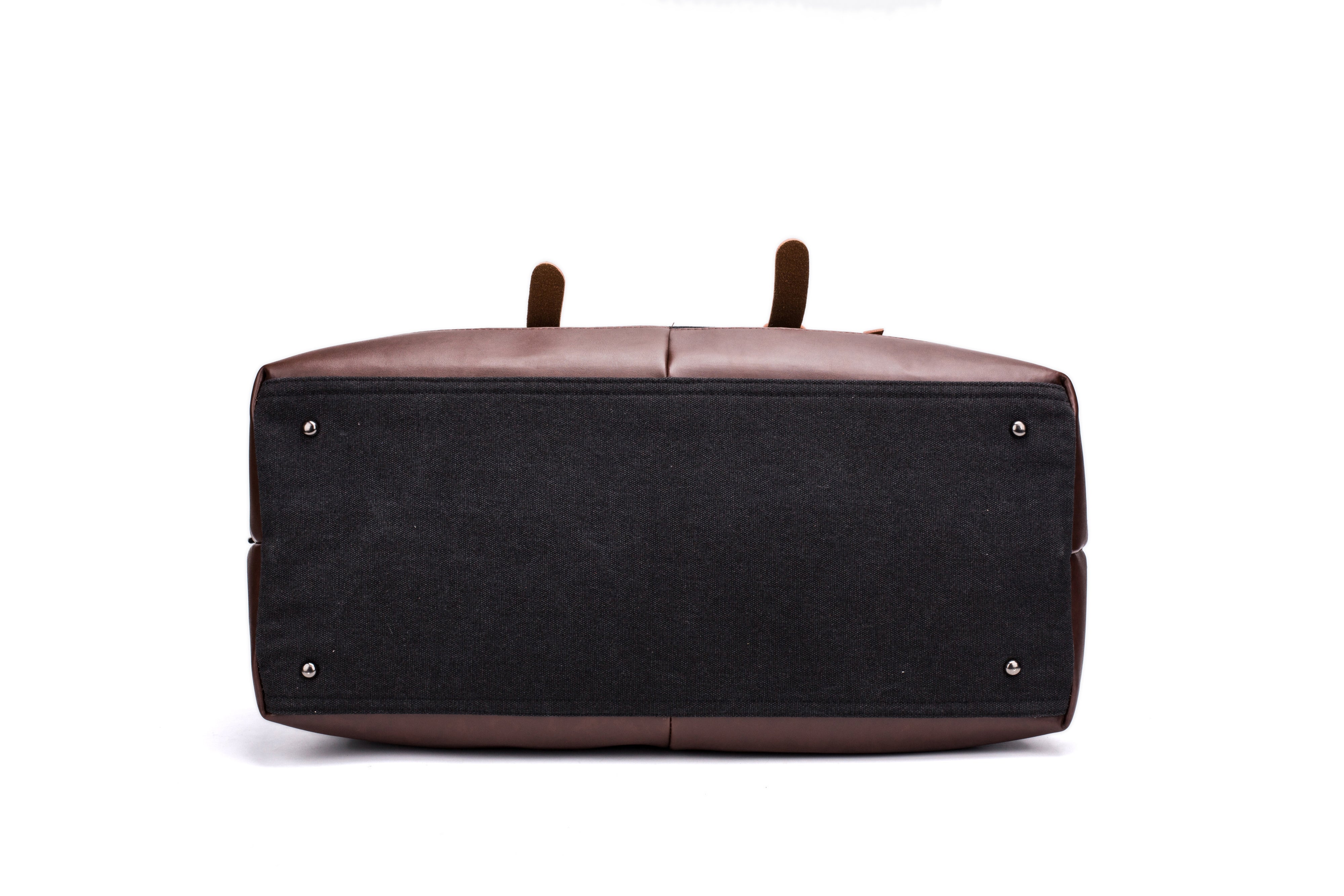 A black and brown Parvus 42L Duffel Bag, perfect as a weekend bag, travel bag, and carry-on luggage. This stylish and durable bag features seven pockets and genuine leather accents, making it ideal for short getaways, longer trips, and daily use.
